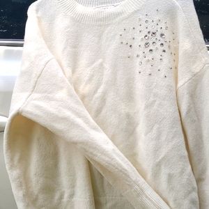Cream sweater with gem embellishment